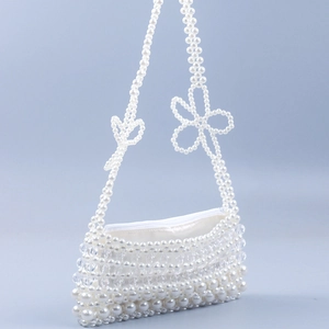 Elegant white pearl beaded shoulder bag with floral accents and satin lining