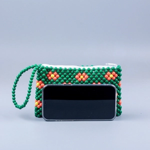 Handmade green beaded clutch with retro floral pattern and beaded wrist strap