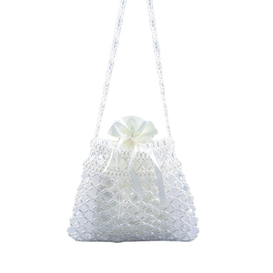 Elegant white handmade pearl crossbody bag with drawstring lining and woven trapezoid design