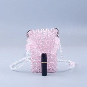 Pink handmade beaded mini crossbody bag with heart strap accents for women