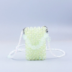 Handmade green beaded crossbody bag for women with decorative acrylic hearts