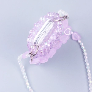 Detail of purple handmade beaded earphone case with heart charm and long beaded chain
