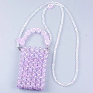 Detail of purple handmade beaded mini bag featuring heart charms and long crossbody chain
