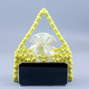 Detail of yellow handmade beaded tote bag with satin drawstring pouch and size reference