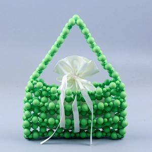 Green beaded handmade handbag with white satin drawstring liner for modern women