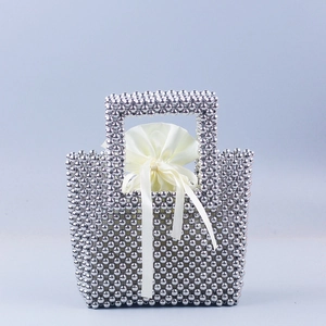 Handmade silver beaded tote bag with inner satin drawstring pouch and metallic finish