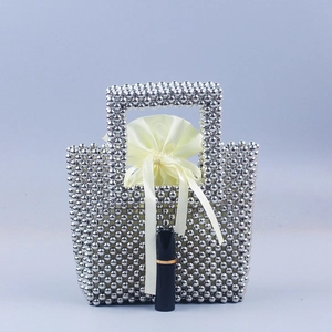 Handmade silver beaded mini handbag with yellow satin drawstring liner and square handle