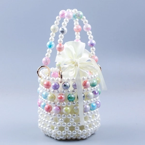 Detail of handmade pearl bead handbag with marble-patterned beads and silk inner pouch