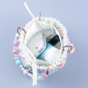 Handmade woven pearl bucket bag with satin drawstring pouch and iridescent beads