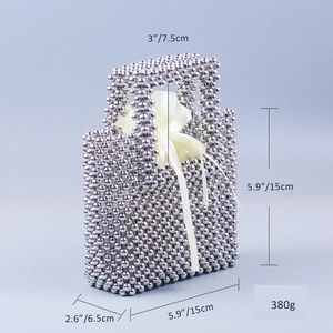 Detailed dimensions of silver beaded handbag with satin drawstring lining in macro view