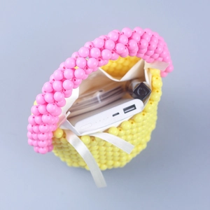 Handgefertigte Perlenbeuteltasche in Pink und Gelb mit Schleife und Stofffutter