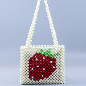 Handmade beaded strawberry shoulder bag in off-white with red fruit pattern
