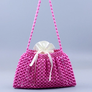 Fuchsia beaded woven handbag with white satin drawstring liner for summer beach style