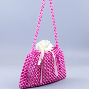 Pink handmade beaded handbag with white drawstring pouch for summer party style