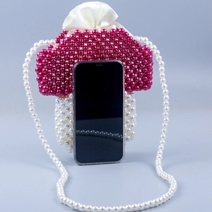 Handmade mushroom pearl bag with red and white beads featuring a drawstring satin lining