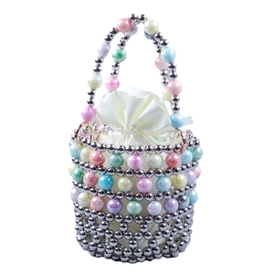 Handmade macaron beaded bucket bag with metallic silver accents and satin drawstring pouch
