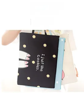 Close-up of portable A4 file bags with zipper handles and cute cartoon character prints