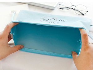 Internal view of a light blue canvas document bag showing large storage capacity