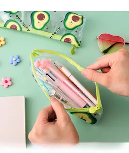 Detail of transparent avocado pencil case being opened to show large inner capacity