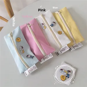 Canvas pencil cases in sky blue, pink, white, and lemon yellow with cute brooches