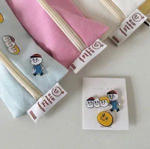 Morandi canvas pencil cases in blue, pink, and beige with cute decorative pins