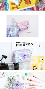 Detail of glitter makeup bag with sequin stars and cute cartoon embroidery