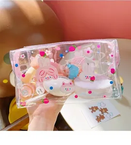 Close-up of transparent PVC makeup bag with pink zipper and cute cartoon rabbit patterns