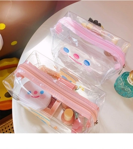 Detailed macro view of transparent waterproof PVC makeup bags with cute cartoon prints