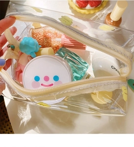 Detail of transparent PVC makeup bag showing large capacity for storing various cosmetics