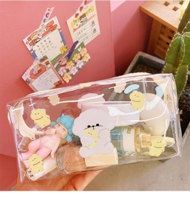 Detailed view of clear waterproof bag featuring cute cartoon dog and bear illustrations
