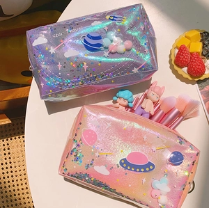 Holographic space planet cosmetic bags in purple and pink with Star Travel prints