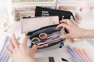 Close-up of a large capacity PU leather pencil case showing wide opening and interior space