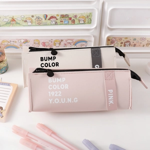 Detail of Korean-style PU leather pencil cases with side handles in pink and cream