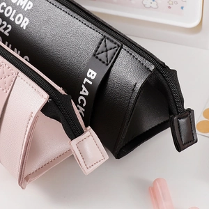 Minimalist PU leather pencil case with triangular design and smooth zipper closure