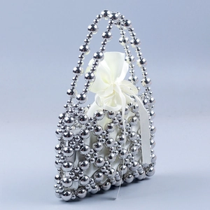Handmade silver beaded tote bag with a white satin drawstring lining and bow detail