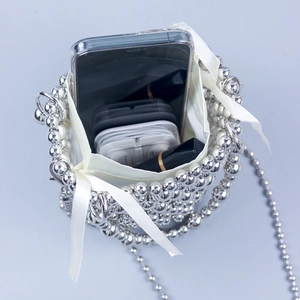 Handmade beaded bucket bag with pearls and silver beads showing interior storage capacity