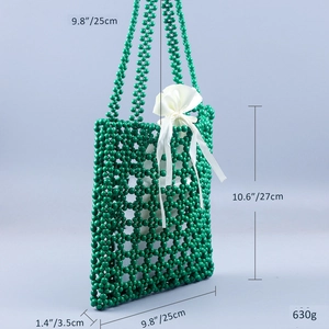 Detail view of green beaded tote bag with white satin drawstring lining and dimensions
