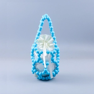 Detail of light blue beaded bucket bag with white satin drawstring lining and woven beads