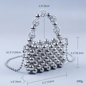Detailed view of silver metallic beaded weave handbag with 120cm ball chain strap