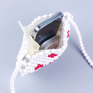 Handmade beaded crossbody bag with white cat paw pattern and pearl shoulder strap