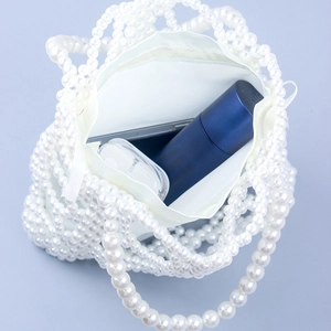 Handmade woven pearl handbag with white fabric lining and large storage capacity
