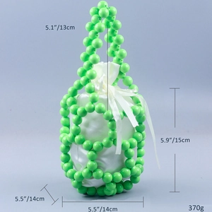 Detail view of woven beaded bucket bag in green showing dimensions and white drawstring liner