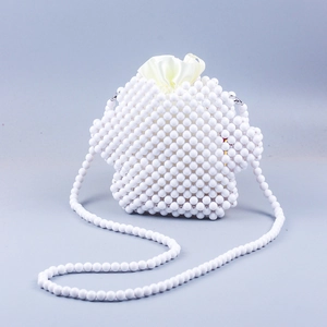 White handmade beaded crossbody bag in cute cat paw design with satin drawstring liner