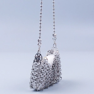 Silver metallic chainmail crossbody bag with sequins and long beaded chain strap