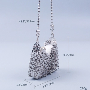 Detail of silver metallic sequin crossbody bag showing 115cm chain and weave texture
