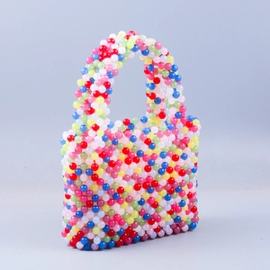 Handmade rainbow beaded handbag featuring vibrant acrylic crystals and a square woven design