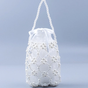 Elegant white beaded handbag with faux pearls and satin drawstring pouch in minimalist style