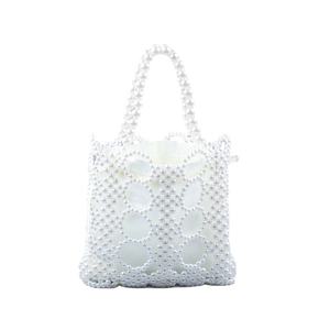 Handmade woven pearl handbag with hollow geometric pattern and white satin lining