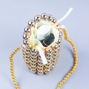 Golden pearl beaded bucket bag with drawstring liner and long shoulder strap