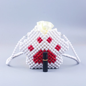 Handmade beaded crossbody bag with cute cat paw design and yellow drawstring liner